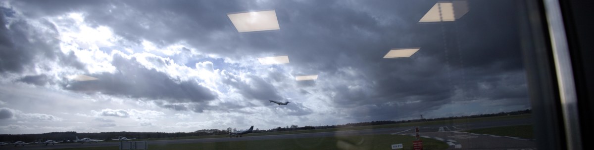 View through the window of a jet taking off