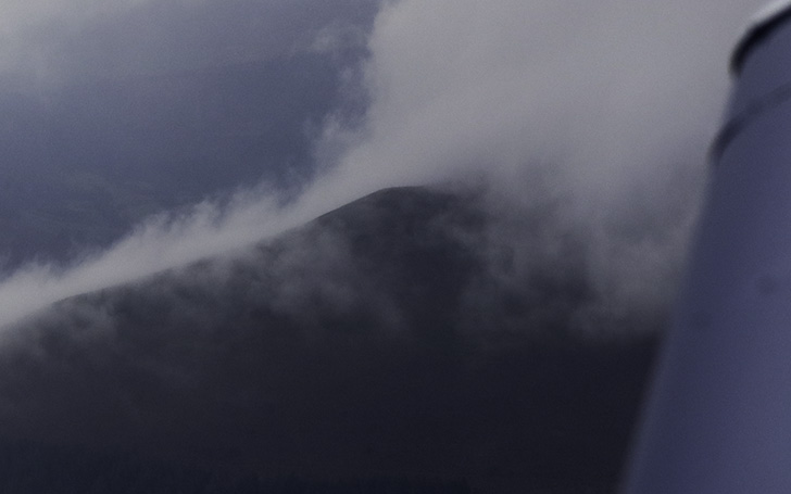 Mountain peak surrounded by cloud